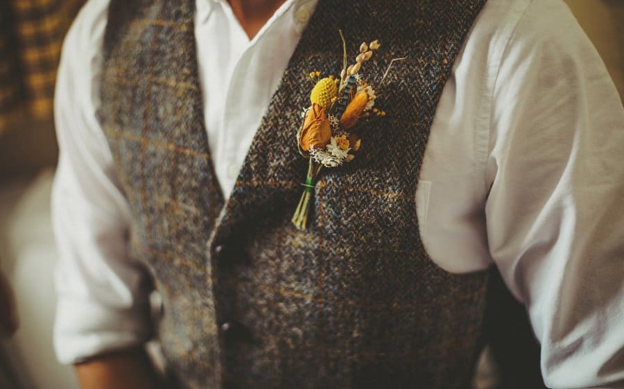 The grooms flower on his lapel