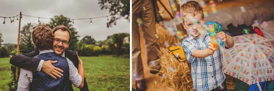 A wedding guest hugs the groom
