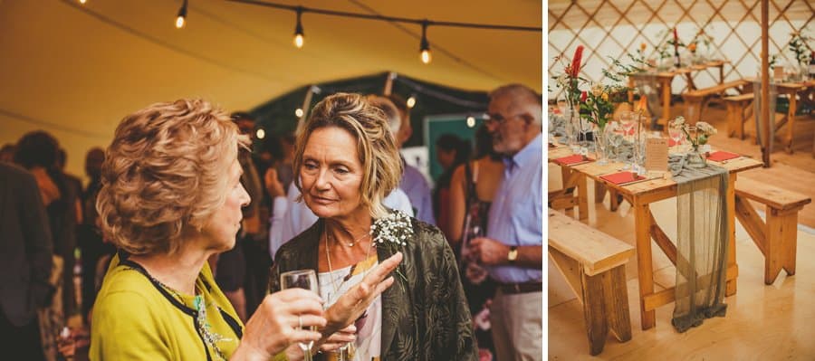 Wedding guests sip champagne and chat amongst themselves