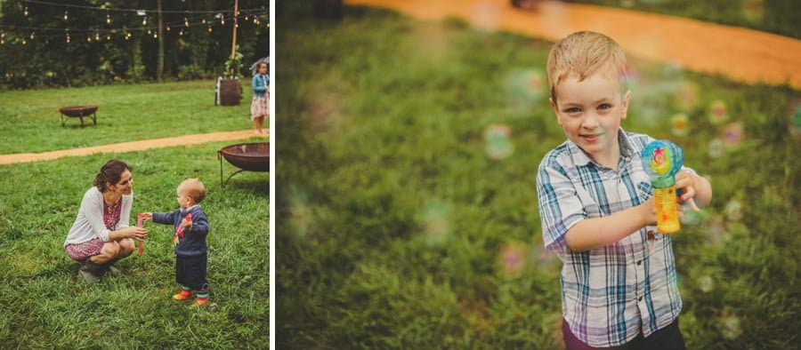 A boy blows bubbles from a plastic gun
