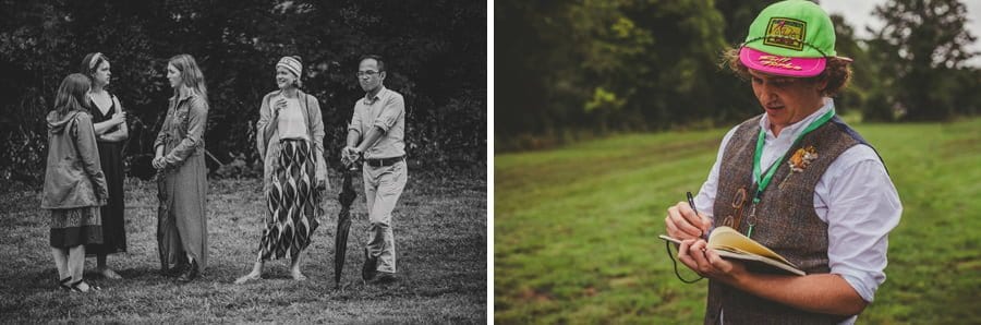An usher stands on the field and writes down the finishing positions of the runners