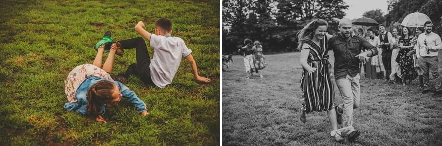 Two children involved in the running game, fall onto the grass