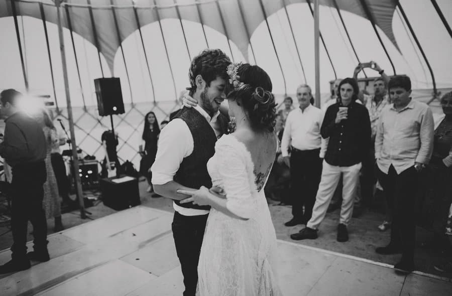 The bride and groom celebrate their first dance in the yurt at Hexton school