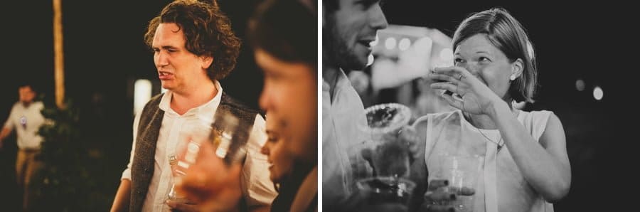 An usher and a wedding guest drink whisky outside on the school field
