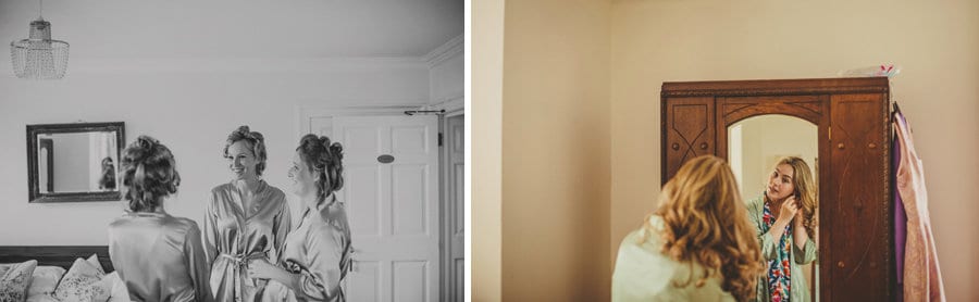 Bridesmaids talking amongst themselves and a lady fastens ear rings as she looks in the mirror