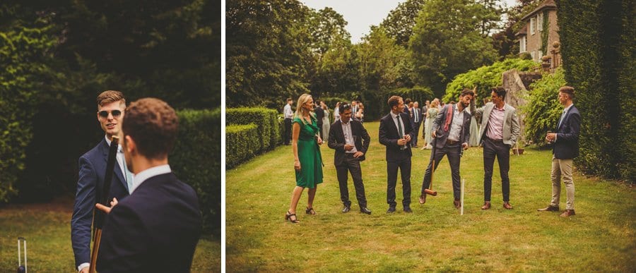 Wedding guests playing croquet on the back lawn