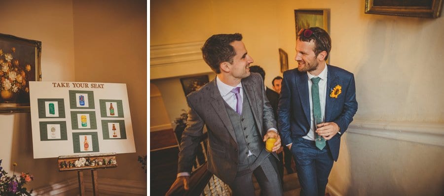 Take your seat wedding board and guests walking up the main staircase