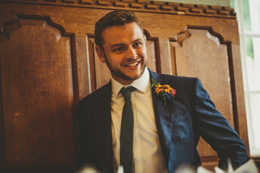 One of the ushers stands up and speaks