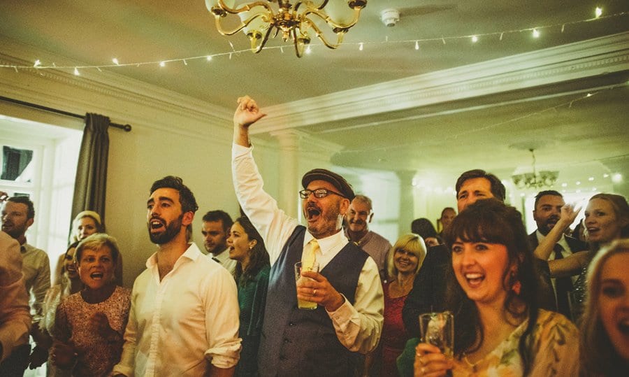 Wedding guests congratulate the wedding band on the dance floor