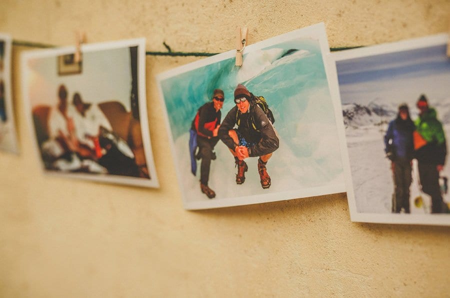 Photographs hang from a piece of string