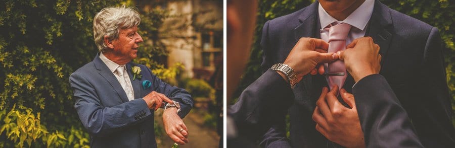 The brides father looks at his watch and a lady straightens an ushers tie