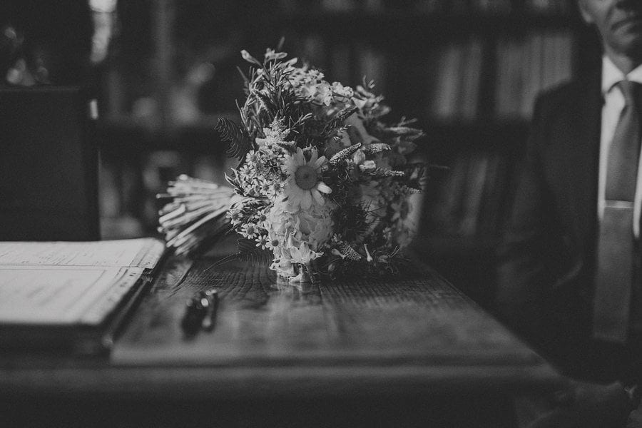 THe brides wedding bouquet on the wooden table