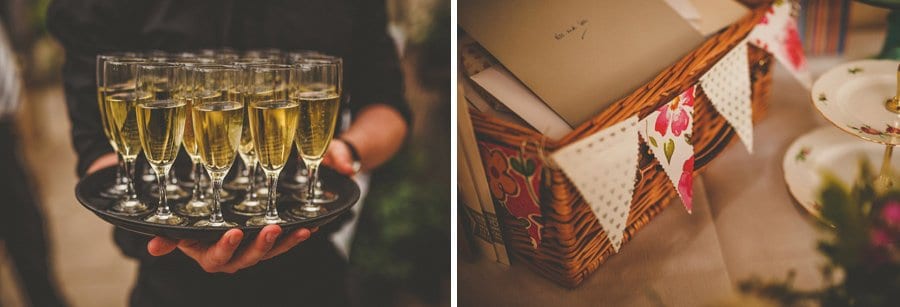 A member of staff at Abbey House gardens holds a tray of champagne flutes