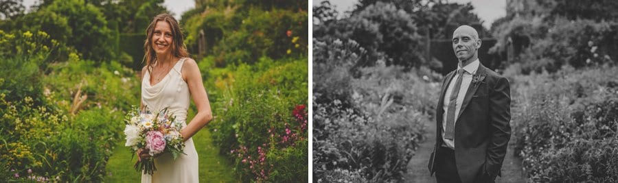 The bride and groom pose for photographs in the gardens at Abbey House