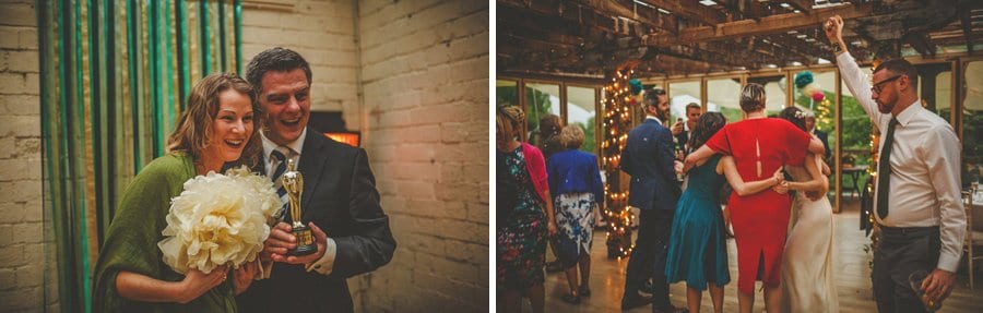 Wedding guests pose for photographs and dancing on the dancefloor