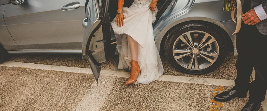 The bride leaves the wedding car in Clifton