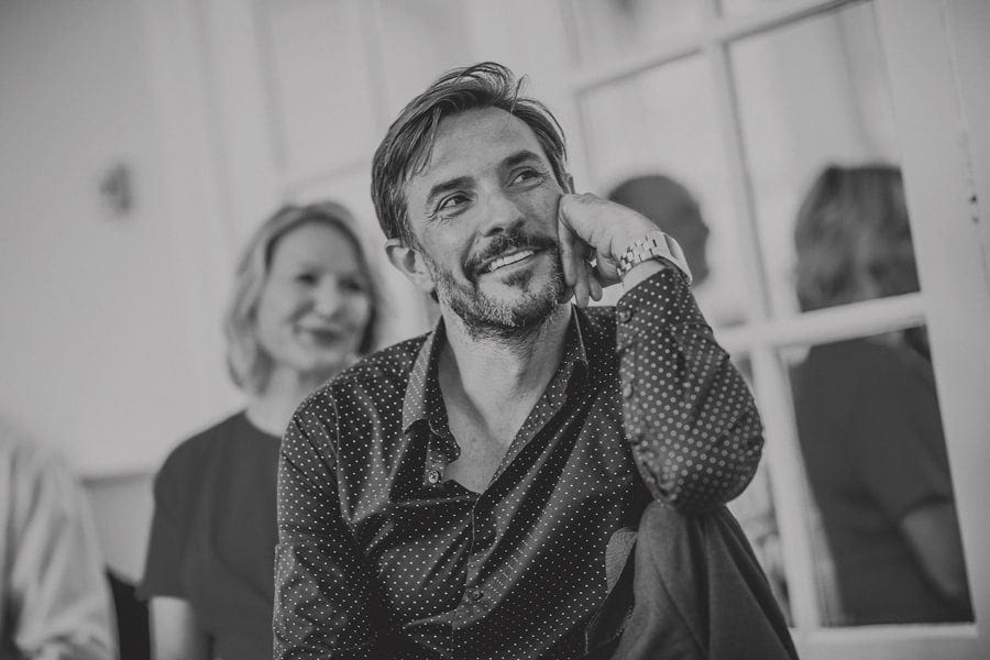 A wedding guest sits at the table and listens to the wedding speech