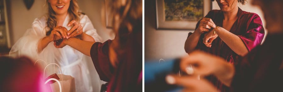 Bridesmaids put on bracelets given as wedding gifts by the bride and groom