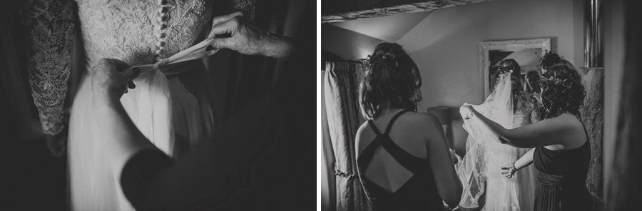 Bridesmaids pull the bride's veil back across the bedroom