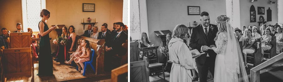 The groom places a wedding ring on the finger of the bride during the wedding ceremony