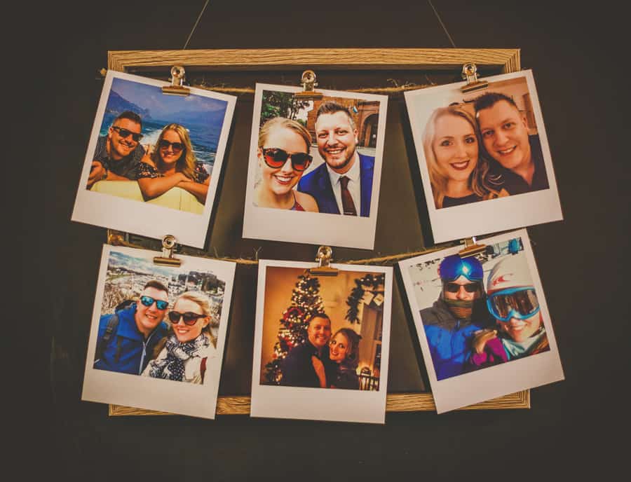 Polaroid prints on a wooden frame of the bride and groom