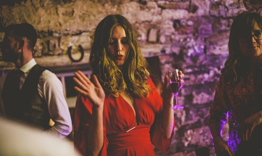 A wedding guest dancing at Eden Barn
