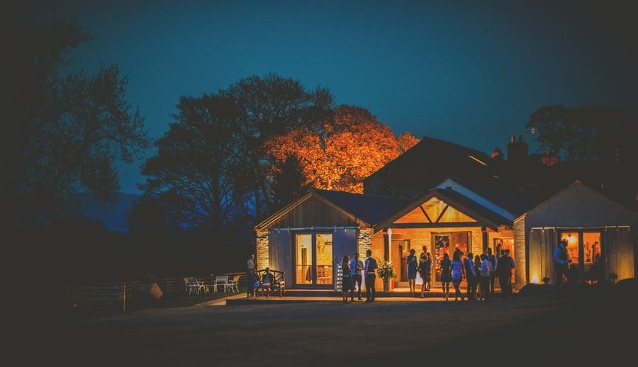 Wedding guests outside Eden Barn in Little Musgrave