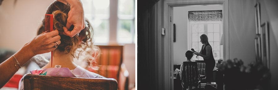 The hairdresser ties the brides hair back