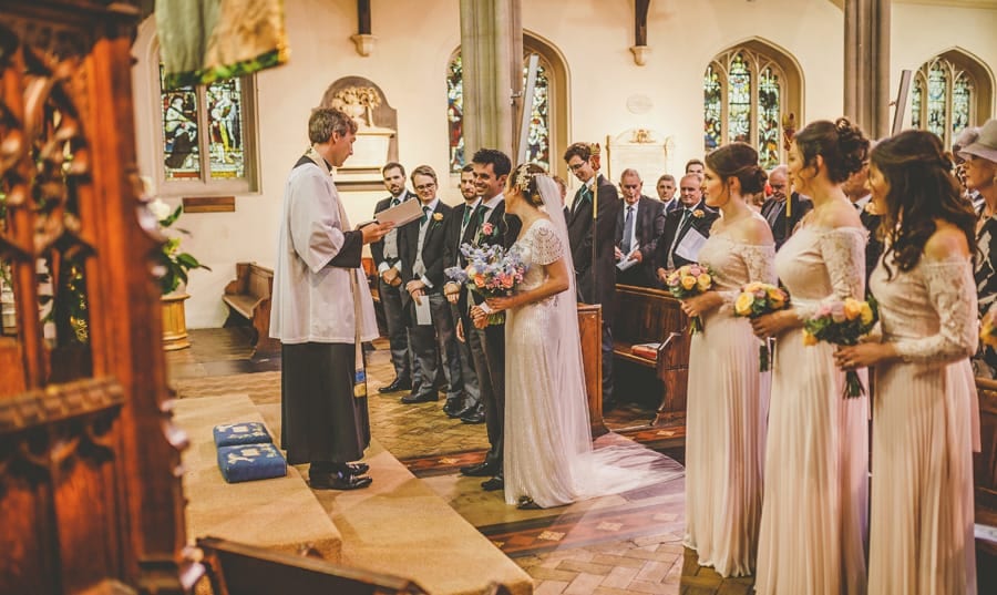 The vicar greets the bride and groom