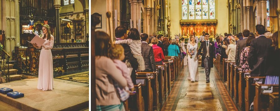 The bride and groom walk down the aisle of the Church together