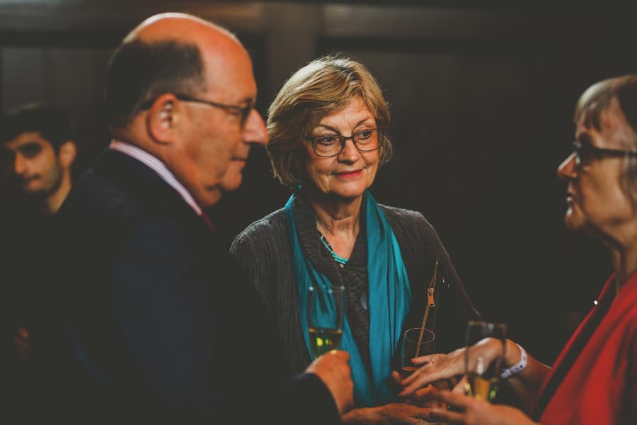 Wedding guests chat amongst themselves