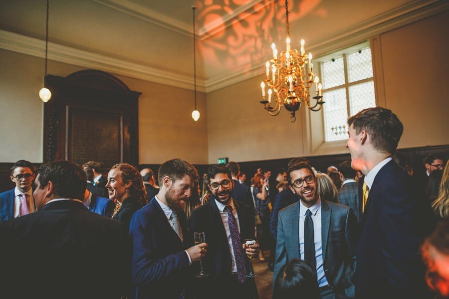 The grooms family talk amongst themselves in a room at Fulham Palace