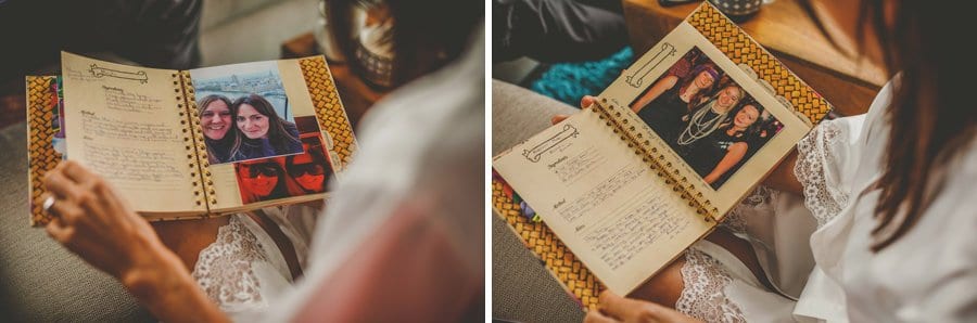 The bride looks at her book of photographs