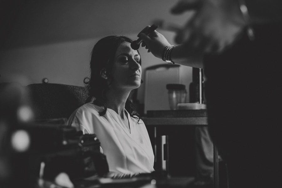 The bride has her make up applied