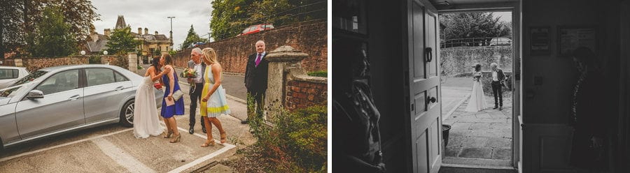 The wedding party greet each other outside Goldney Hall