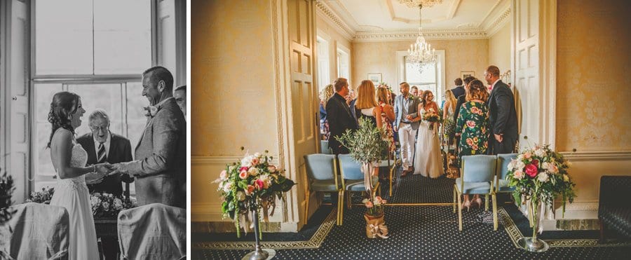 The bride and groom walk down the aisle for the first time together at Goldney Hall