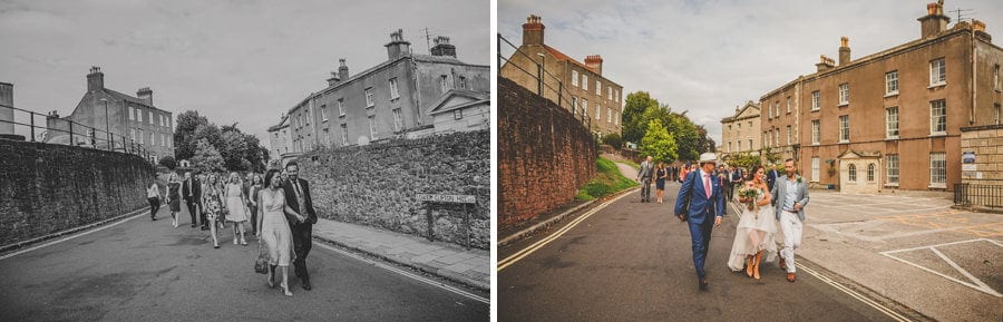 Wedding guests walking across Clifton