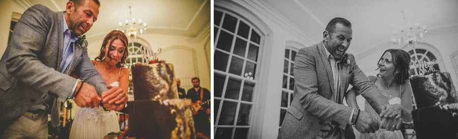 The bride and groom cut wedding cake