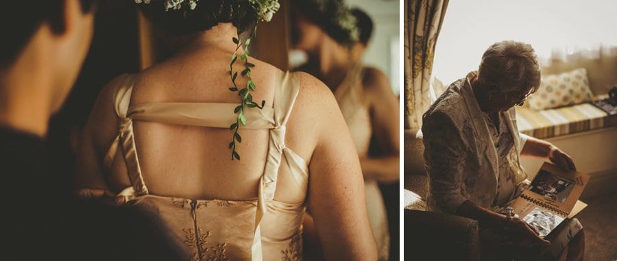 The brides grandmother looks at her daughters photo album sat down next to a window