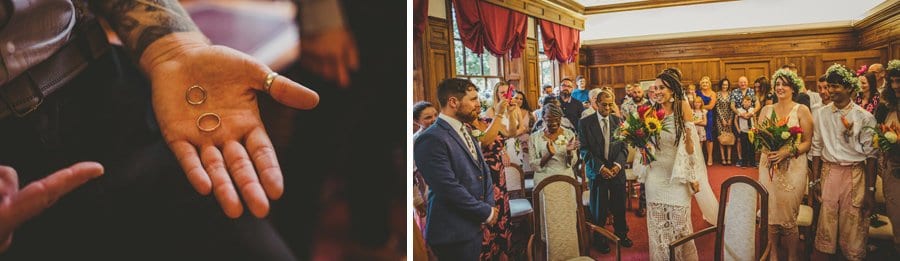The best man holds out the wedding rings in his hand