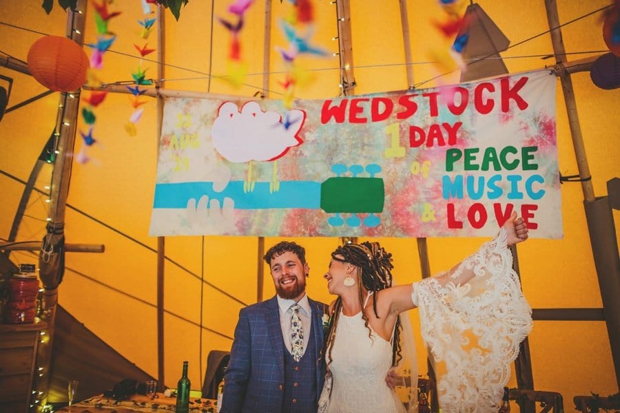 The bride and groom enter the tipi at Hadsham Farm
