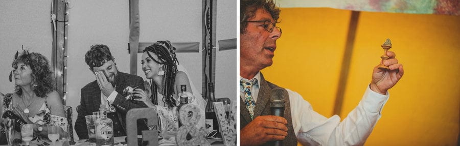 The groom wipes a tear from his eye with a handkerchief and his wife comforts him