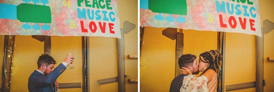 The bride and groom kiss each other