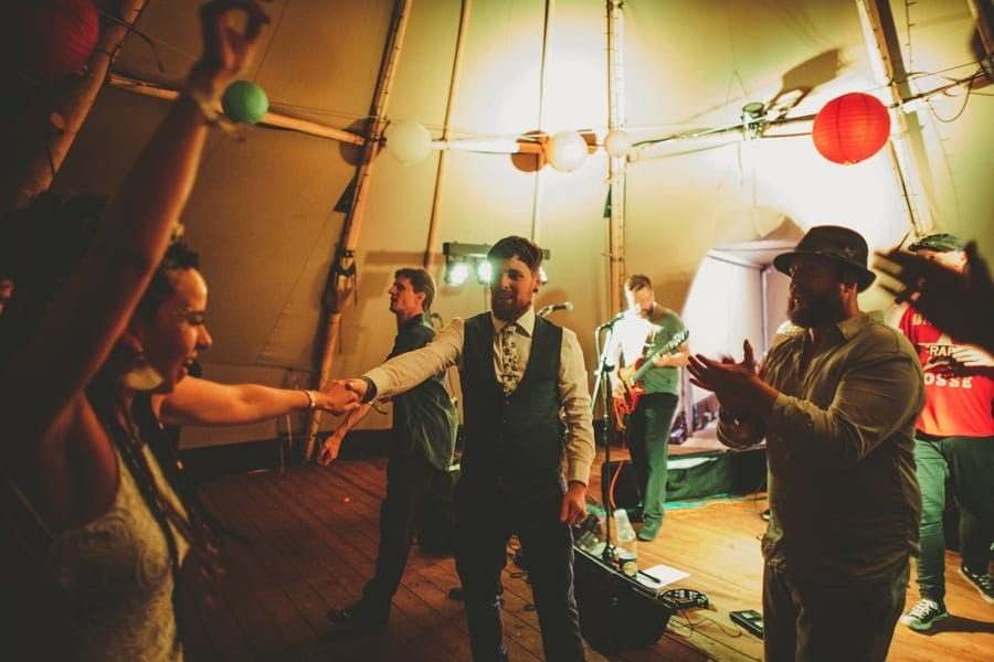 The bride and groom on the dancefloor in the tipi at Hadsham Farm