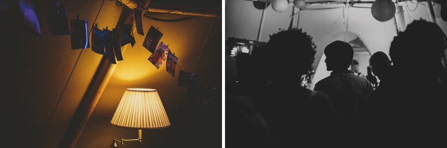 Photographs of the bride and groom hang from a piece of string above a lampshade in the tipi at Hadsham Farm