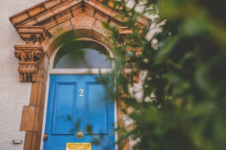 The blue front door of the bride and grooms house in Bristol