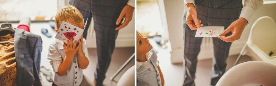 The groom looks at a card made for him by his nephew
