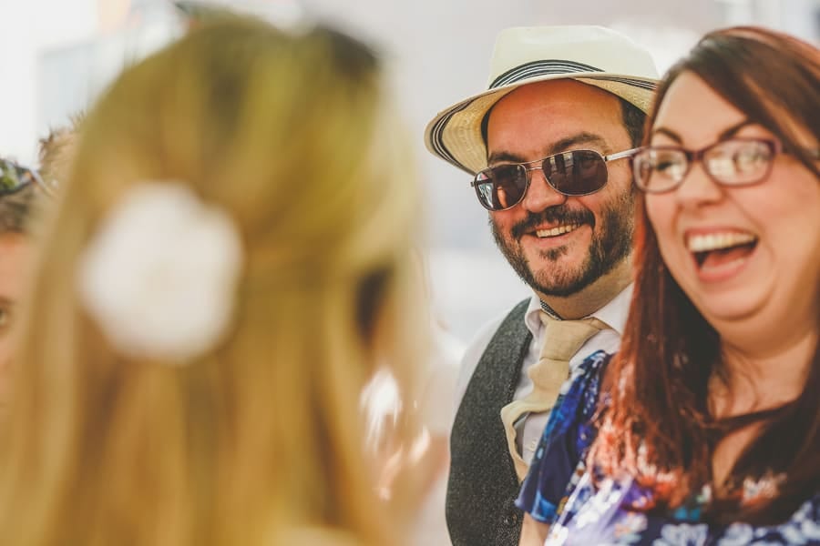 Wedding guests chat amongst themselves