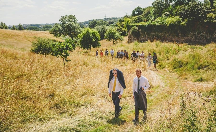 Wedding guests walking towards Hanham Court