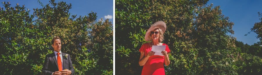 Wedding guests reads poems during the outdoor ceremony in the gardens at Hanham Court